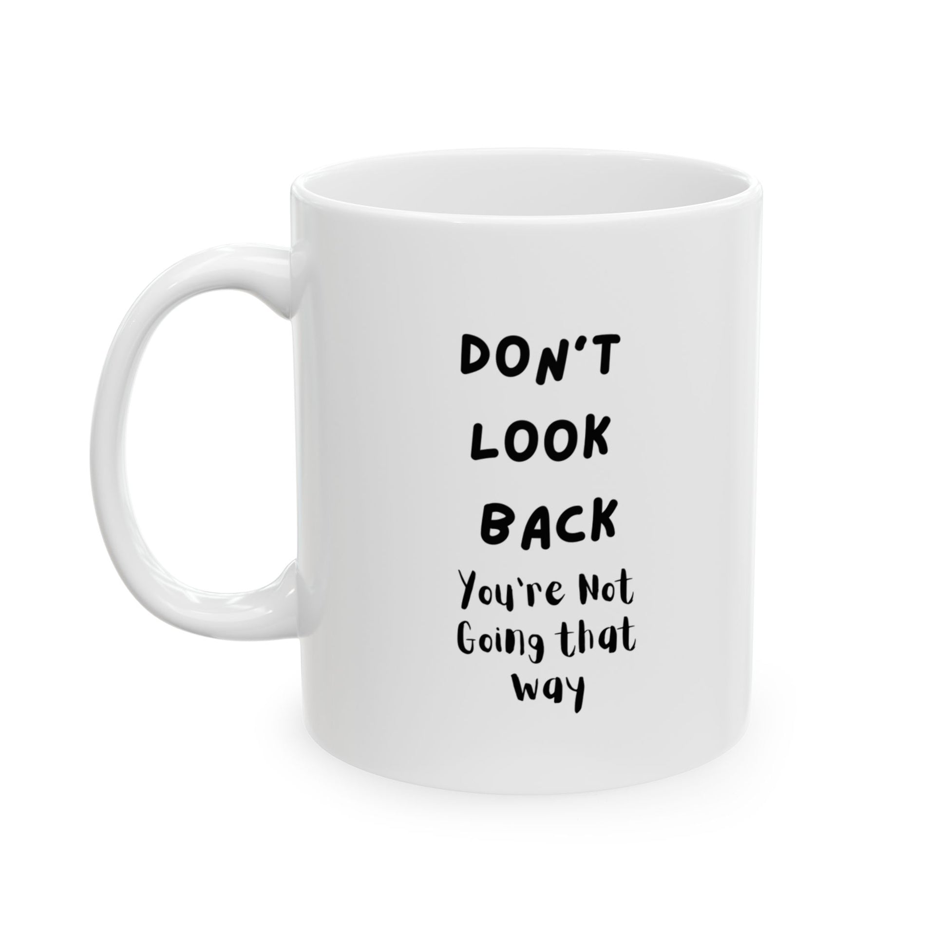 The image shows a white ceramic mug with the text "DON'T LOOK BACK You're Not Going that way" printed in black. This text serves as a motivational message, encouraging the user to focus on the future rather than dwelling on the past.
